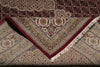 Load image into Gallery viewer, Close-up of an intricately patterned rug with a red border
