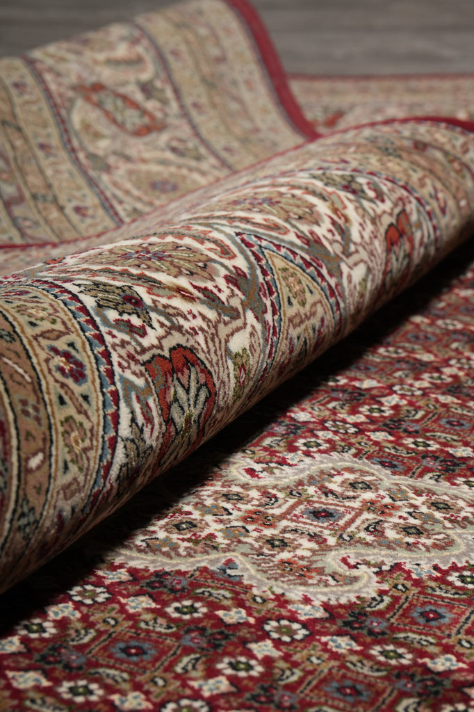 Close-up of patterned rugs with intricate designs.