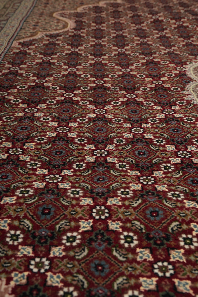Close-up of a patterned rug with intricate designs.