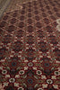 Load image into Gallery viewer, Close-up of a patterned rug with intricate designs.
