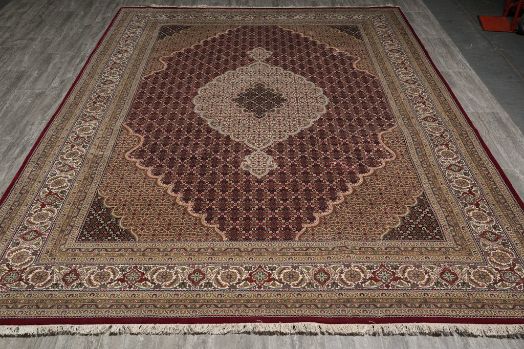 Decorative rug with intricate patterns on a plain floor