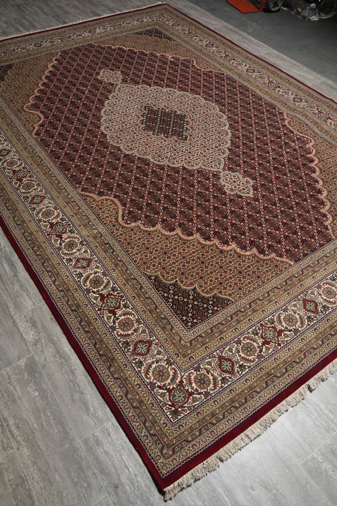 Decorative rug with intricate patterns on a wooden floor