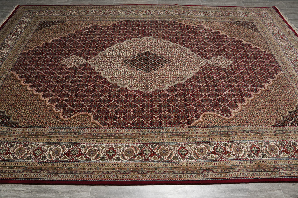Decorative rug with intricate patterns on a wooden floor