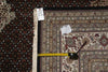 Load image into Gallery viewer, Patterned rug with a measuring tape and small container on top