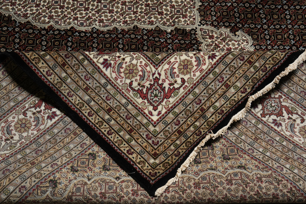 Close-up of a patterned rug with intricate designs.