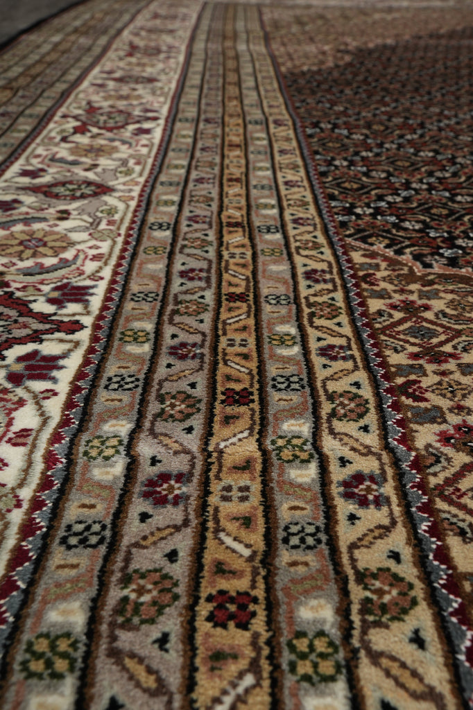 Close-up of a patterned rug with intricate designs.