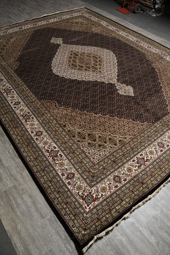 Decorative rug with intricate patterns on a wooden floor