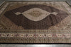 Load image into Gallery viewer, Decorative rug with intricate patterns on a plain background