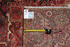 Load image into Gallery viewer, Rug with a measuring tape and label on a red and brown patterned rug
