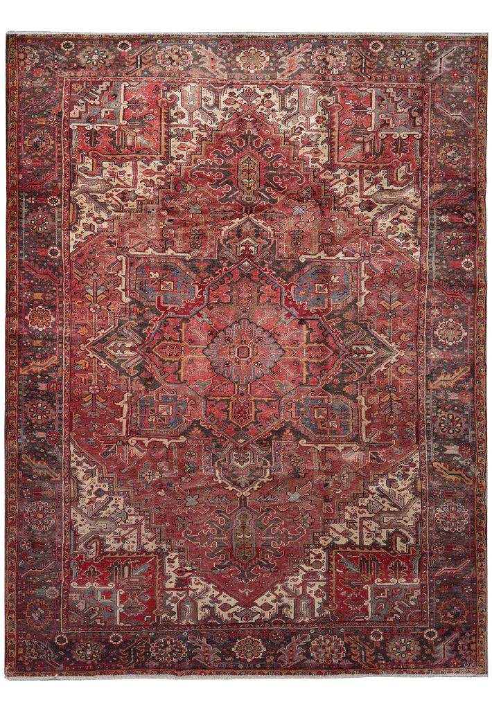 A traditional oriental-style area rug with an intricate floral and geometric medallion pattern in shades of red, brown, beige, and muted blue, shown flat against a white background.