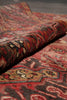 Load image into Gallery viewer, Close-up of a patterned fabric with red, brown, and gold colors.