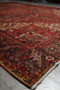 Load image into Gallery viewer, Close-up of a patterned rug on a concrete floor