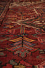 Load image into Gallery viewer, Close-up of a patterned red rug with intricate designs