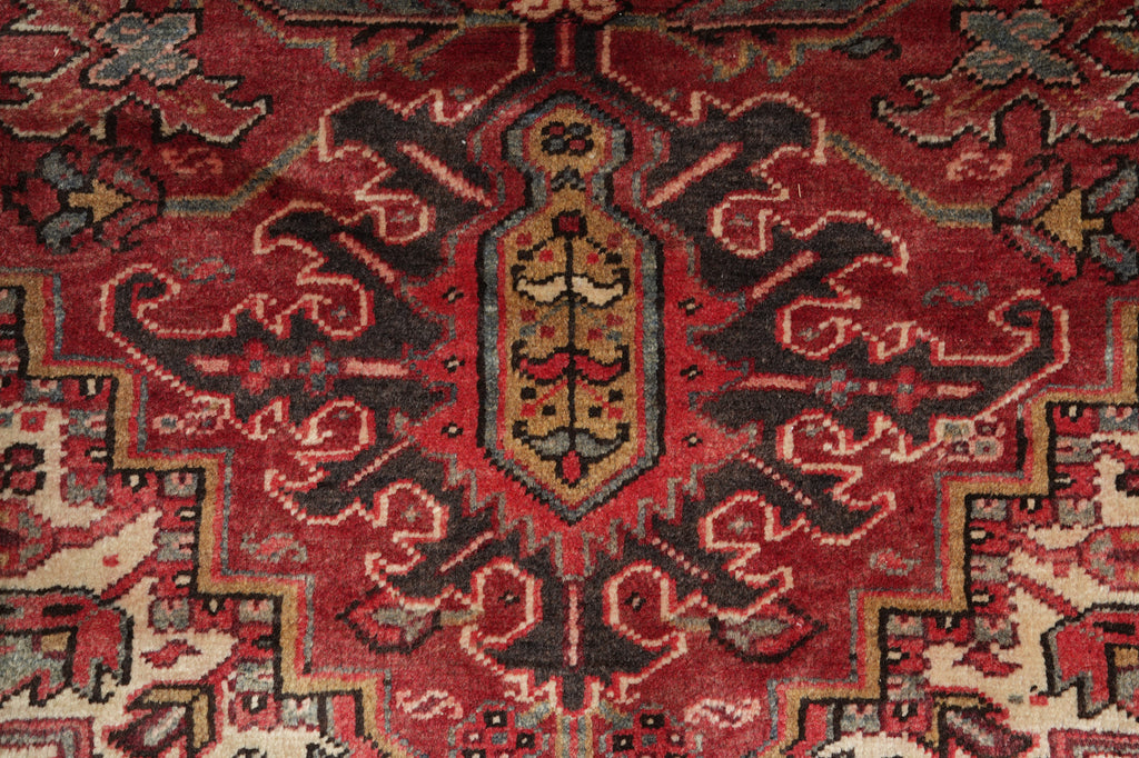 Close-up of a red patterned rug with intricate designs
