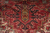 Load image into Gallery viewer, Close-up of a red patterned rug with intricate designs