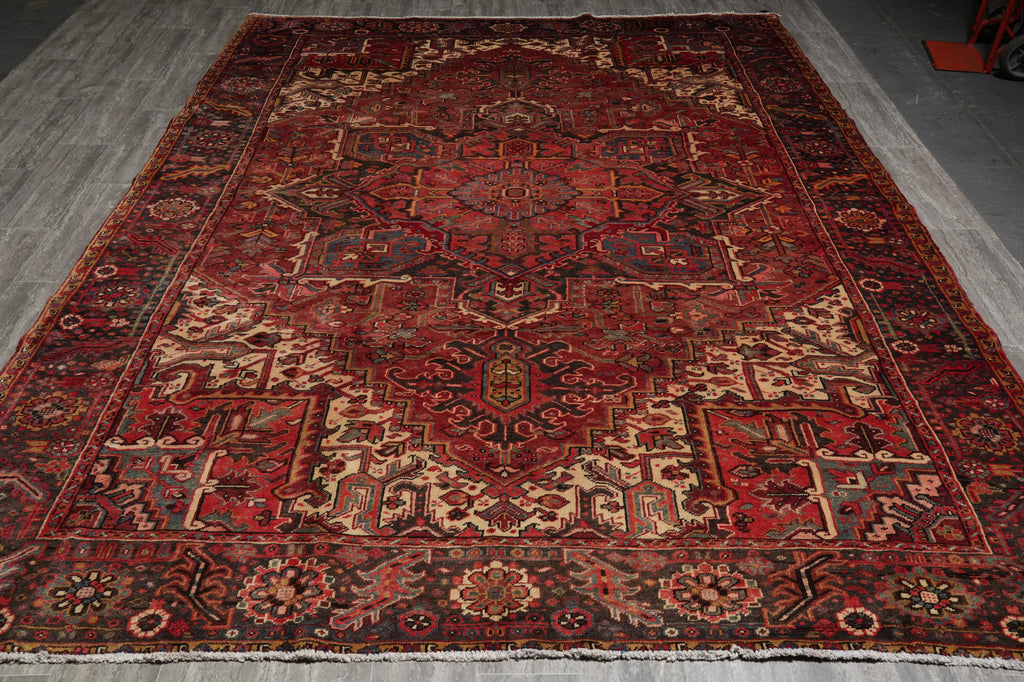 Decorative rug with intricate patterns on a gray floor