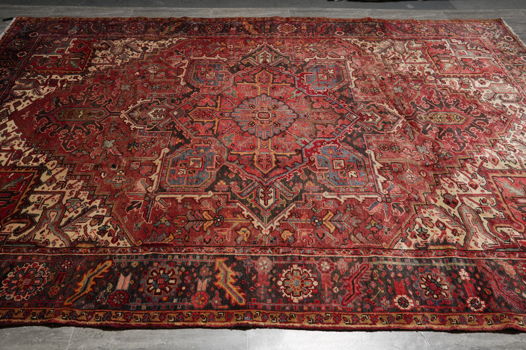 Vintage rug with intricate patterns on a plain background