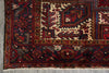 Load image into Gallery viewer, Close-up of an intricately designed rug with geometric patterns on a gray surface.