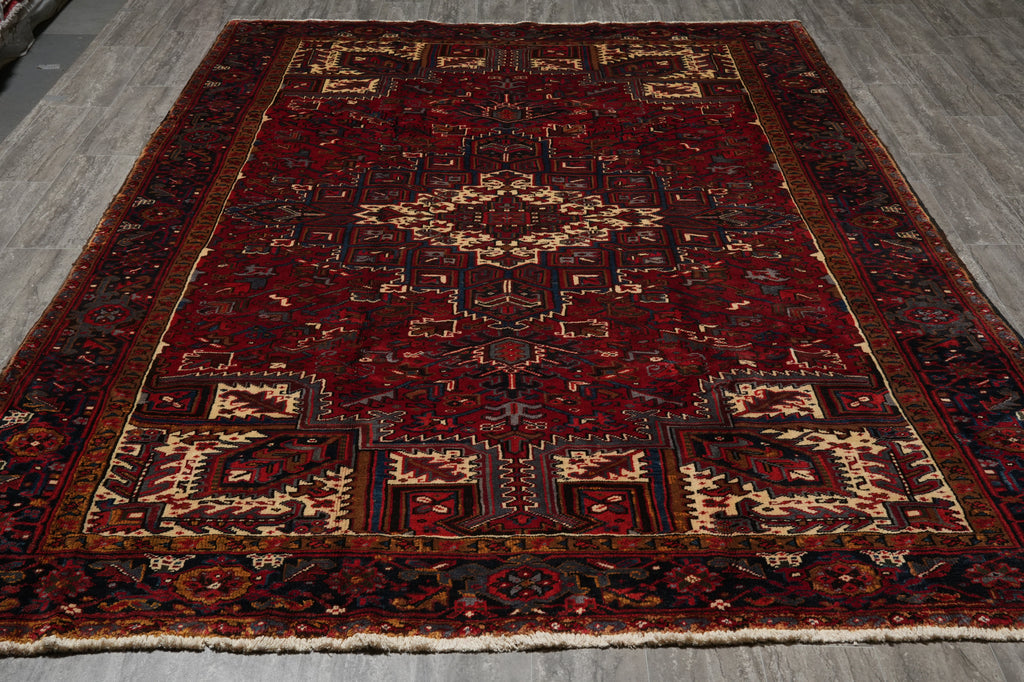 Decorative rug with intricate patterns on a wooden floor