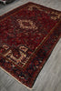 Load image into Gallery viewer, Decorative red and black patterned rug on a wooden floor