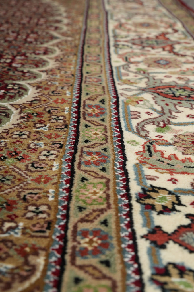 Close-up of an intricately patterned rug with detailed designs.