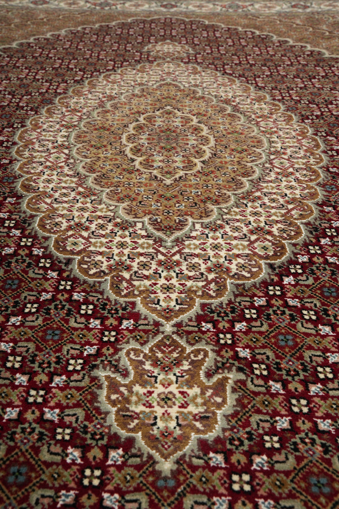 Close-up of a patterned rug with intricate designs.