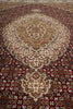 Load image into Gallery viewer, Close-up of a patterned rug with intricate designs.