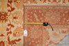 Load image into Gallery viewer, Close-up of a patterned rug with a measuring tape on top