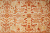 Load image into Gallery viewer, Close-up of a patterned fabric with intricate designs in orange and beige.