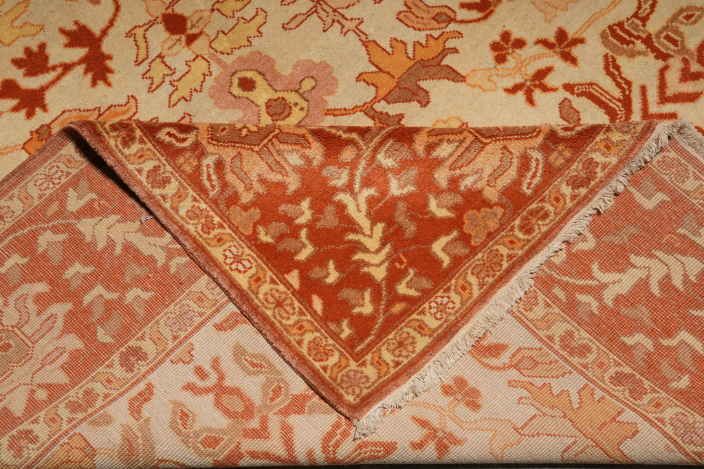 Close-up of an intricately patterned rug with a focus on the corner.
