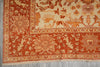 Load image into Gallery viewer, Close-up of an intricately designed red and beige patterned rug.