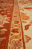 Load image into Gallery viewer, Close-up of a patterned rug with red and beige colors