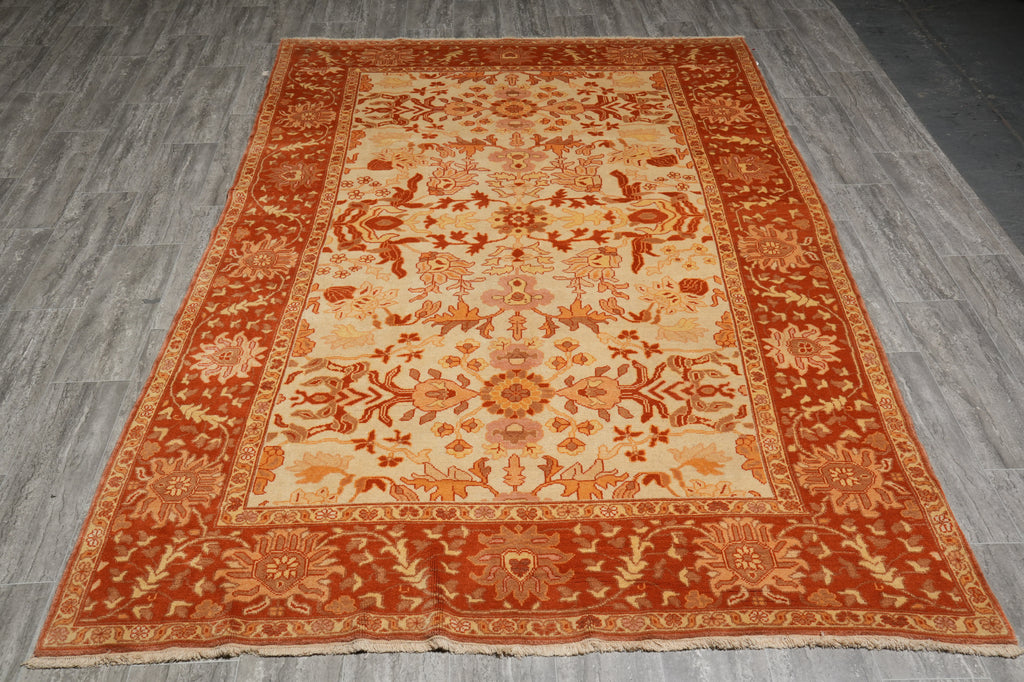 Decorative rug with intricate patterns on a wooden floor