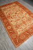 Load image into Gallery viewer, Decorative orange and beige rug on a wooden floor