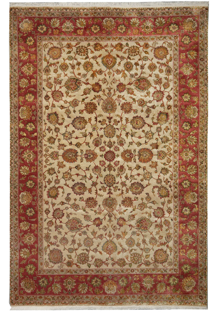 Decorative rug with intricate patterns in red, beige, and gold on a white background