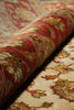 Load image into Gallery viewer, Close-up of a patterned rug with red and beige colors.