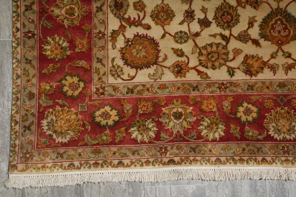 Decorative rug with intricate patterns on a gray floor
