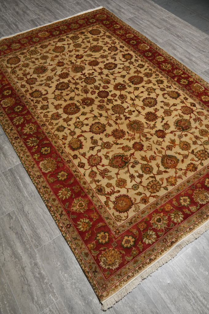 Decorative rug with intricate patterns on a wooden floor