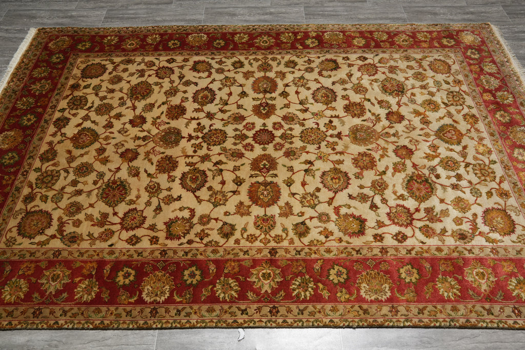 Decorative rug with intricate patterns on a wooden floor