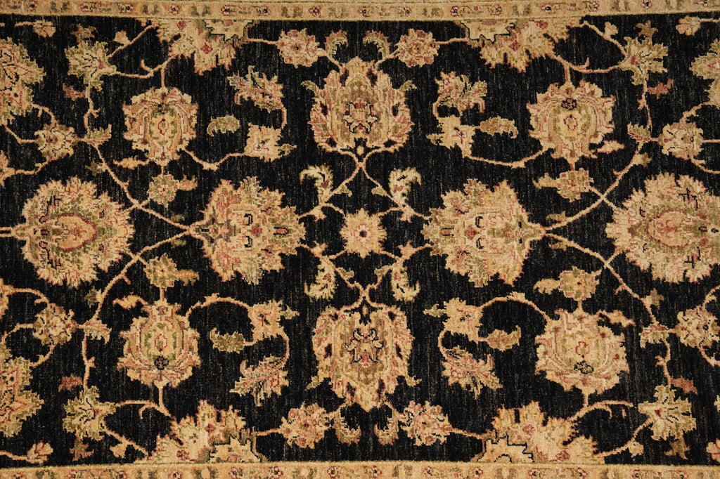 Close-up of an ornate rug with intricate patterns on a black background