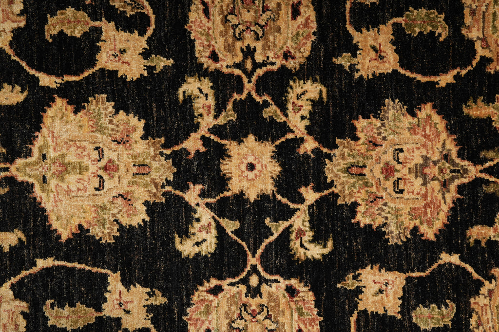 Close-up of an ornate rug with intricate patterns on a dark background