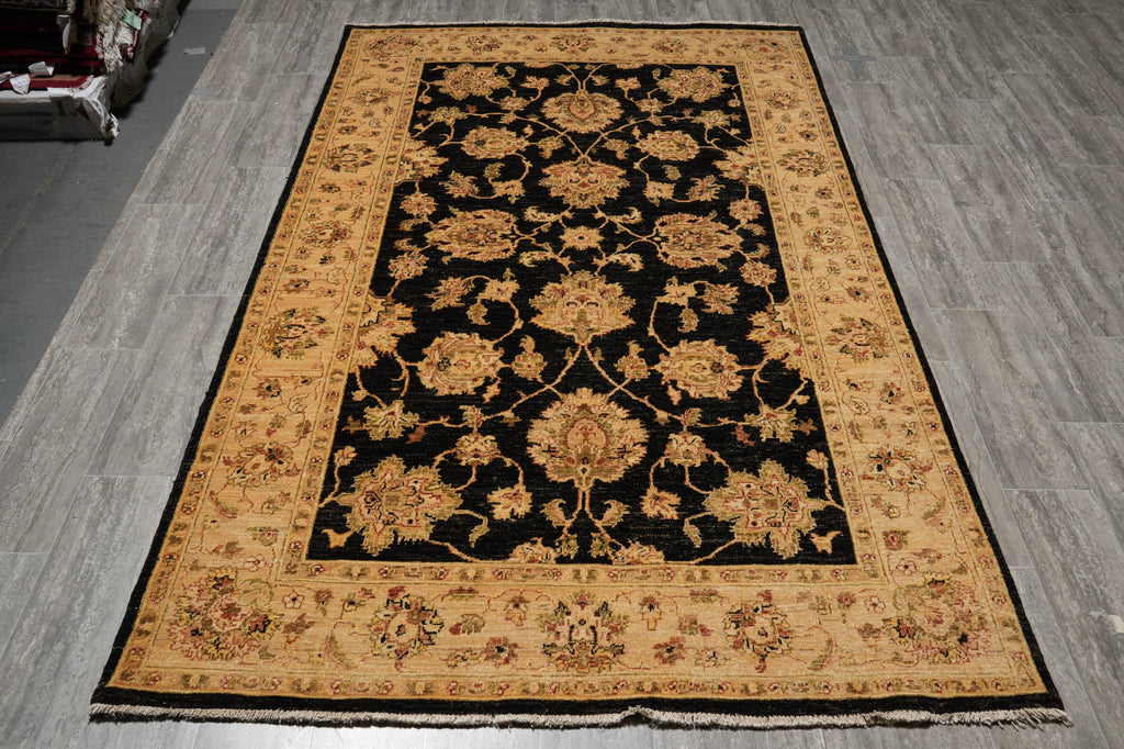 Decorative rug with intricate patterns on a wooden floor