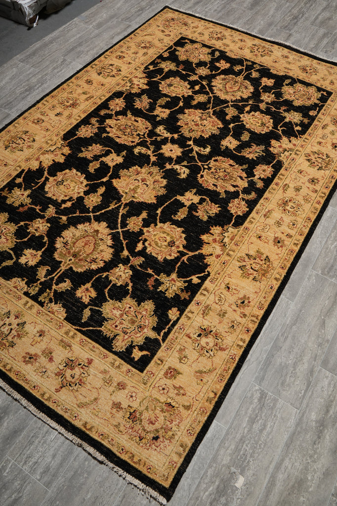 Decorative rug with floral pattern on a wooden floor