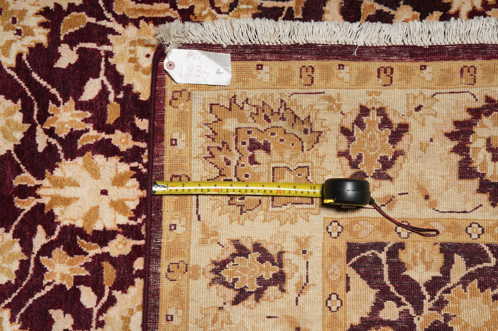 Patterned rug with a measuring tape laid across it
