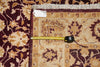Load image into Gallery viewer, Patterned rug with a measuring tape laid across it