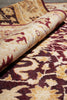 Load image into Gallery viewer, Close-up of a patterned fabric with intricate designs in red and beige.