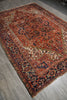 Load image into Gallery viewer, Vintage patterned rug on a wooden floor