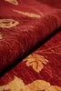 Load image into Gallery viewer, Close-up of red fabric with gold floral patterns