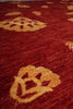Load image into Gallery viewer, Close-up of a textured red fabric with floral patterns.
