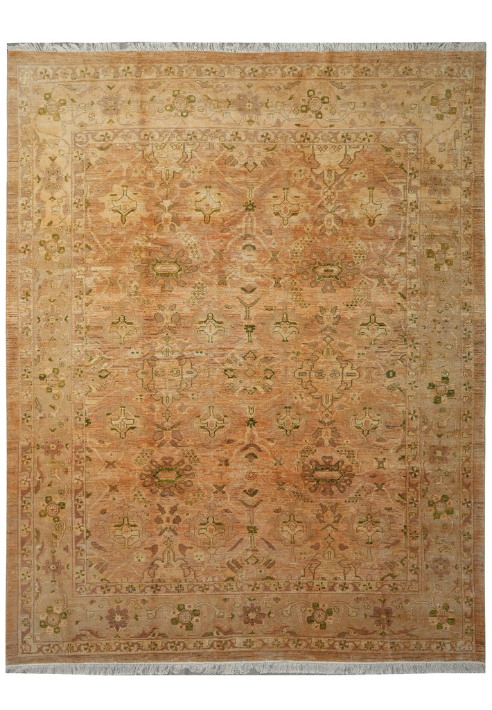 Patterned rug with earthy tones on a plain background